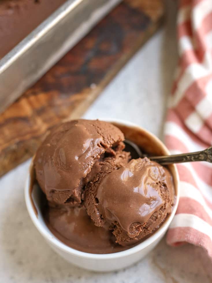 top view of creamy chocolate ice cream slightly melting 
