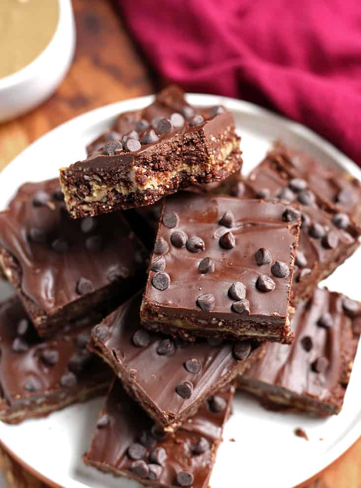 a stack of paleo sunbutter fudge cookie bars on a plate