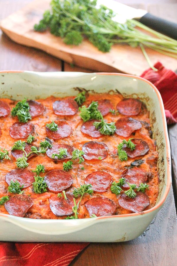 This Paleo Baked Spaghetti is loaded with veggies, but feels like comfort food. All the flavors of delicious spaghetti with crispy pepperoni on top- the best!