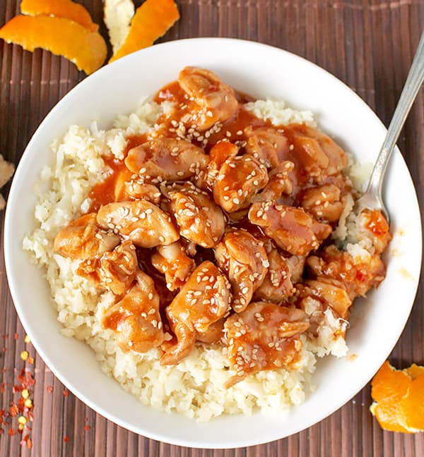 This Paleo Orange Chicken has so much flavor and is made in under 30 minutes! The perfect weeknight meal! Gluten free, dairy free, and lightly sweetened with orange juice.