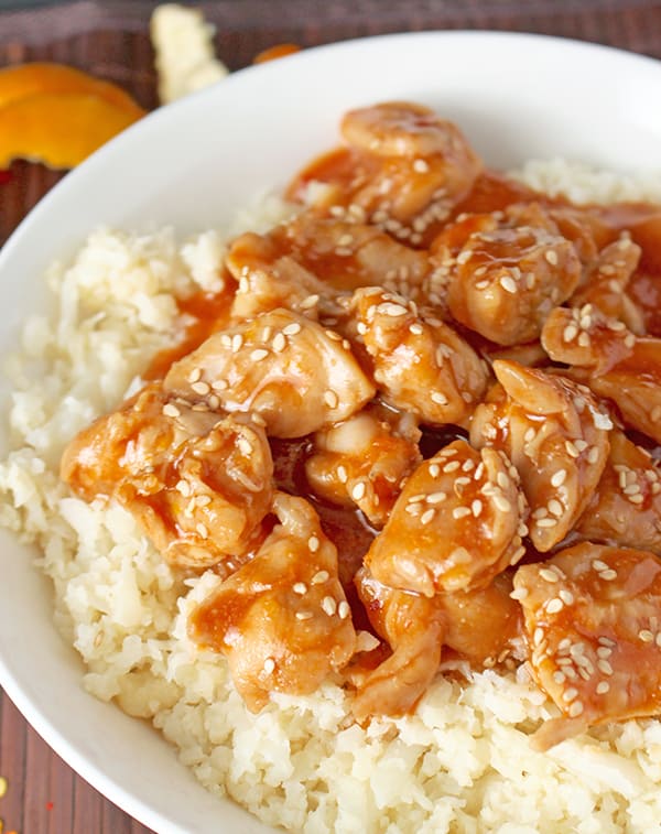 This Paleo Orange Chicken has so much flavor and is made in under 30 minutes! The perfect weeknight meal! Gluten free, dairy free, and lightly sweetened with orange juice.