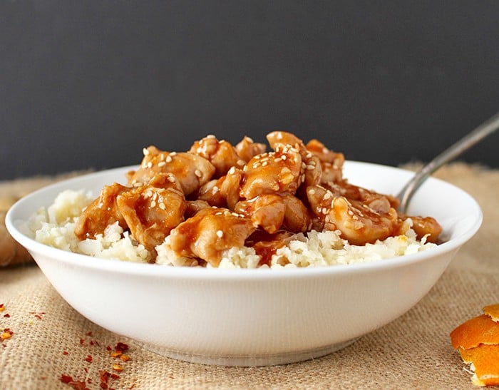 This Paleo Orange Chicken has so much flavor and is made in under 30 minutes! The perfect weeknight meal! Gluten free, dairy free, and lightly sweetened with orange juice.