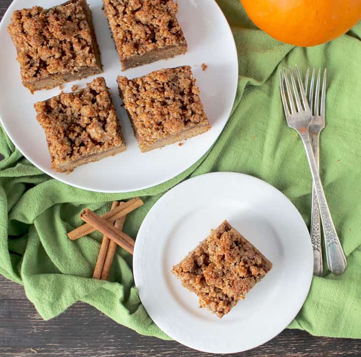 This Paleo Pumpkin Coffee Cake is the perfect fall dessert. A tender cake topped with an irresistible crumb topping. Gluten free, dairy free, and naturally sweetened. 