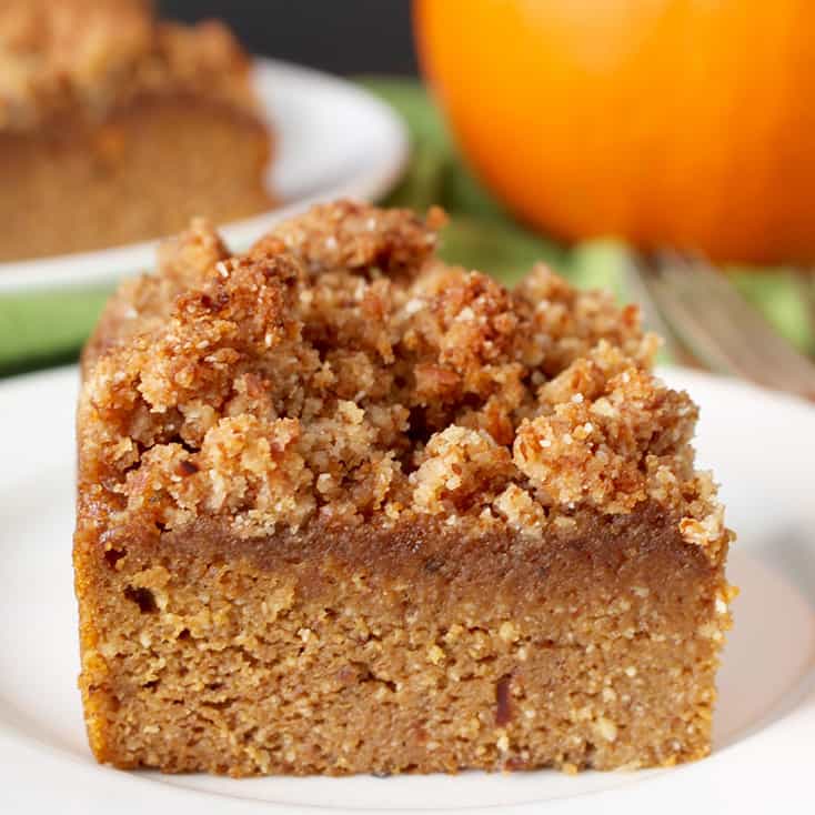 This Paleo Pumpkin Coffee Cake is the perfect fall dessert. A tender cake topped with an irresistible crumb topping. Gluten free, dairy free, and naturally sweetened. 