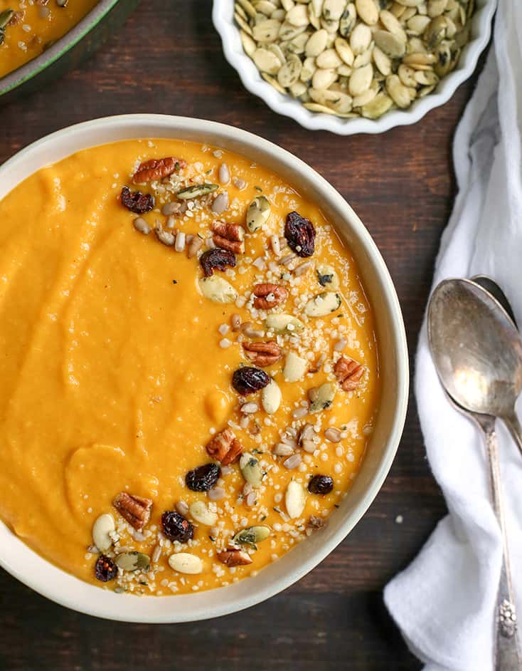 This Paleo Whole30 Squash Soup is creamy, healthy, packed with flavor, and perfect for fall! Butternut squash and pumpkin come together with apples and onions to create a savory soup with just the right amount of sweetness. It's dairy free, and gluten free.