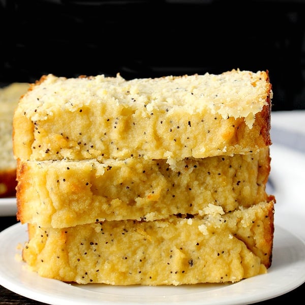 Paleo Lemon Poppy Seed Bread in a stack on a plate. 