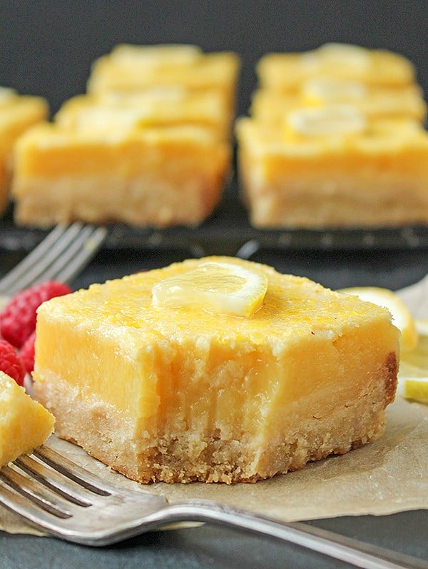 These Paleo Lemon Bars are so full of bright lemon flavor. A simple shortbread crust topped with a creamy, tart lemon filling that is delicious and perfect for spring. They are gluten free, dairy free, and naturally sweetened.