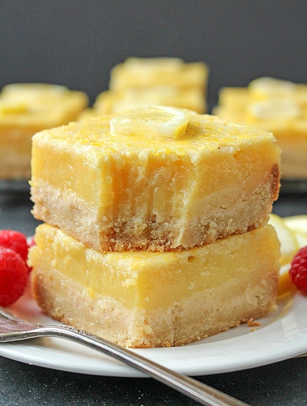 These Paleo Lemon Bars are so full of bright lemon flavor. A simple shortbread crust topped with a creamy, tart lemon filling that is delicious and perfect for spring. They are gluten free, dairy free, and naturally sweetened.