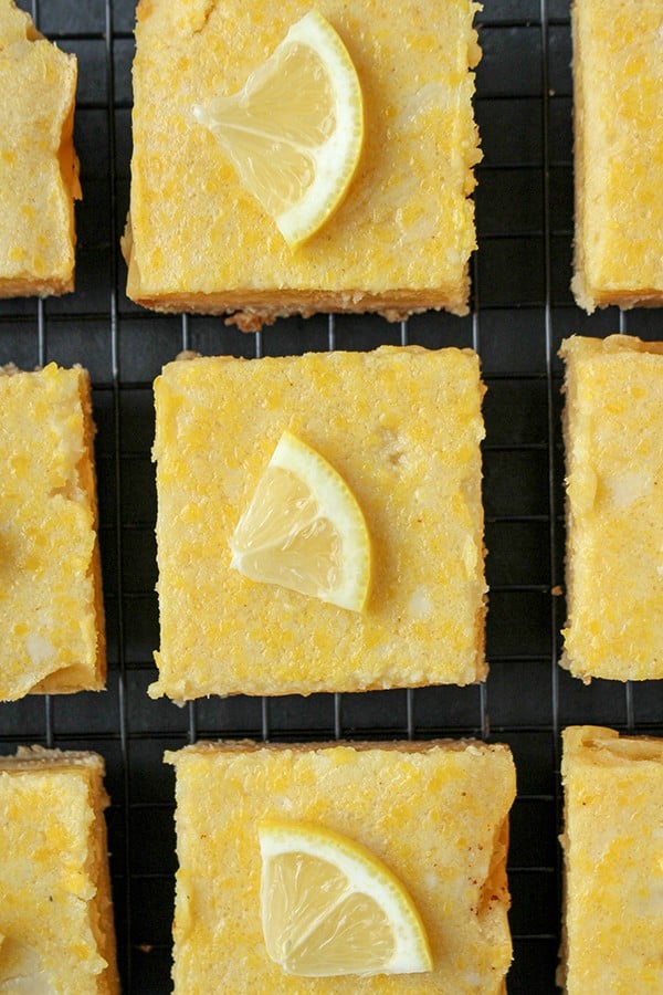 These Paleo Lemon Bars are so full of bright lemon flavor. A simple shortbread crust topped with a creamy, tart lemon filling that is delicious and perfect for spring. They are gluten free, dairy free, and naturally sweetened.