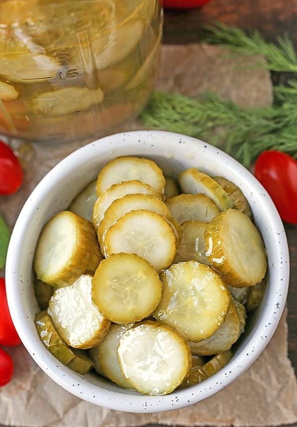 These Paleo Whole30 Dill Pickles are easy and delicious. A healthy alternative to store bought and they take just minutes to make. Crunchy, garlicky, and so good. Made low fodmap with garlic oil!