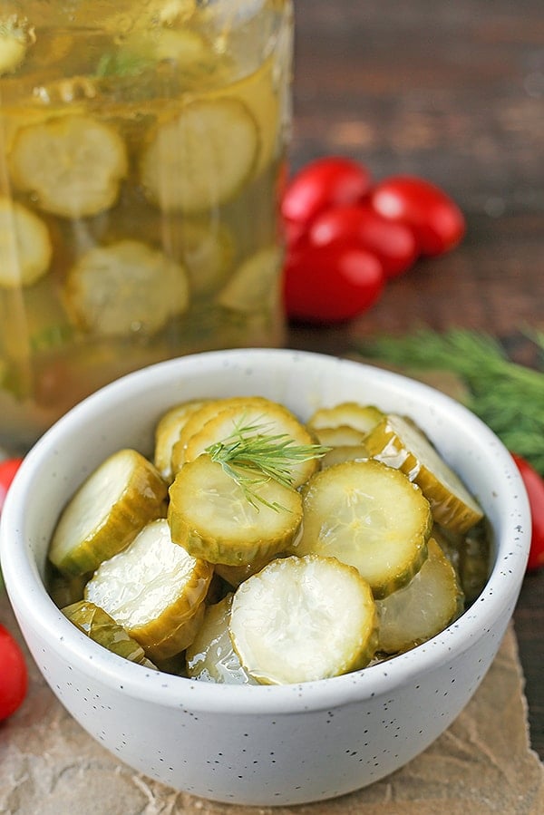 These Paleo Whole30 Dill Pickles are easy and delicious. A healthy alternative to store bought and they take just minutes to make. Crunchy, garlicky, and so good. Made low fodmap with garlic oil!