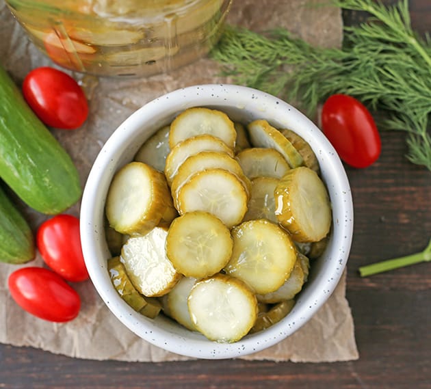 These Paleo Whole30 Dill Pickles are easy and delicious. A healthy alternative to store bought and they take just minutes to make. Crunchy, garlicky, and so good. Made low fodmap with garlic oil!