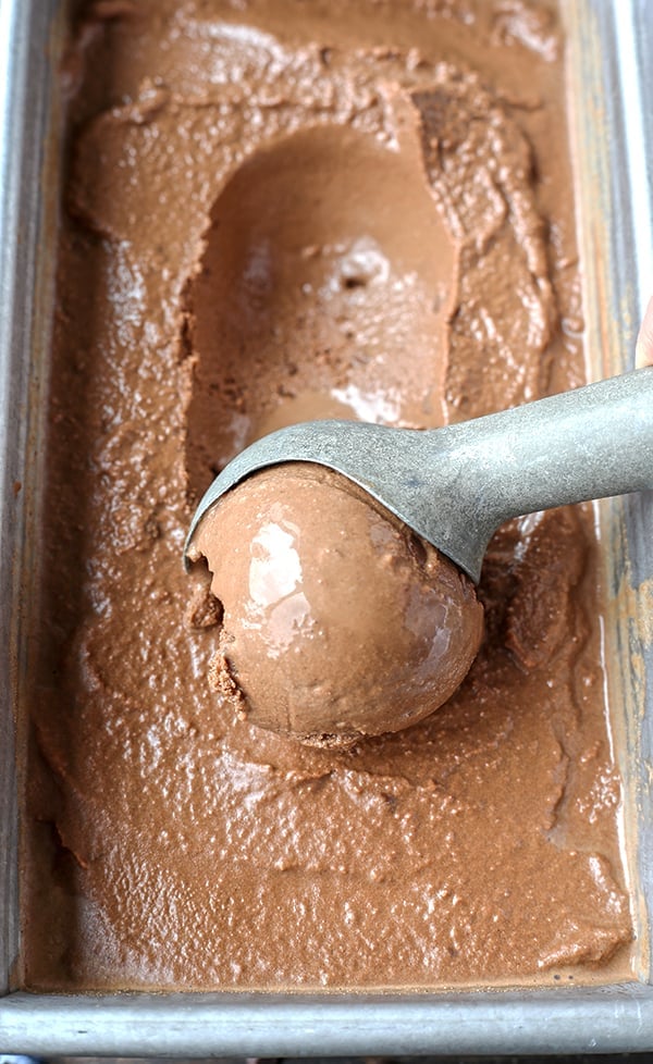 This Paleo Death By Chocolate Ice Cream is rich, creamy, and so delicious! 7 simple ingredients and a little hands on time for a treat that is so good you won't be able to tell it's healthy. Dairy free, naturally sweetened and gluten free.