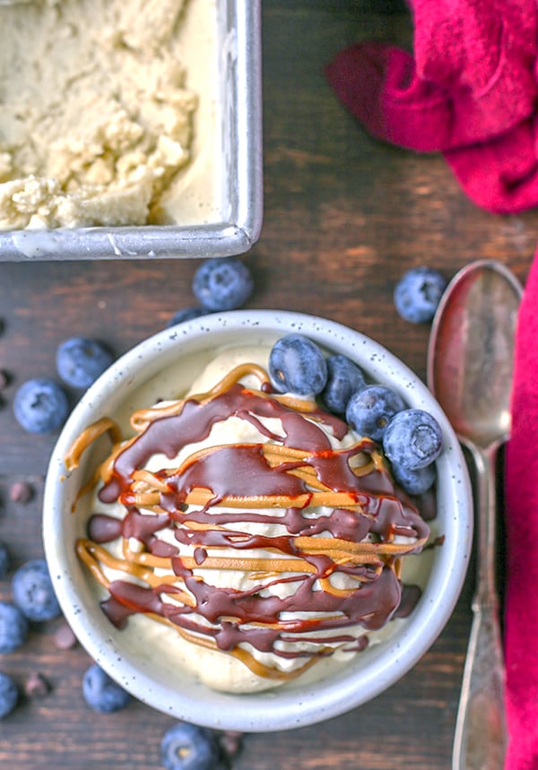 This Paleo Vanilla Bean Ice Cream is creamy, sweet, and so perfect for summer! Only 5 ingredients and ready to be topped with your favorite toppings. Gluten free, dairy free, and naturally sweetened.