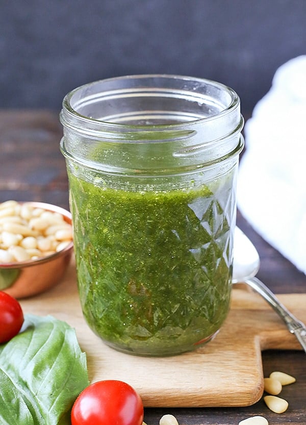 This Paleo Whole30 Basil Pesto also happens to be low fodmap, but still big on flavor! Made with fresh basil, pine nuts, and garlic oil, it is easy and so delicious! Gluten free, dairy free, and low carb.
