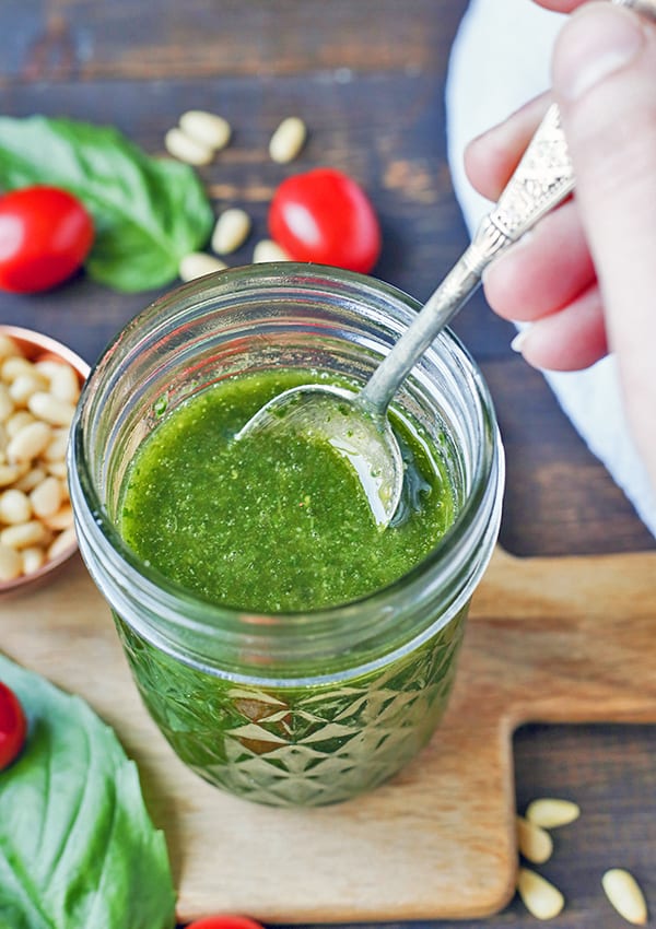 This Paleo Whole30 Basil Pesto also happens to be low fodmap, but still big on flavor! Made with fresh basil, pine nuts, and garlic oil, it is easy and so delicious! Gluten free, dairy free, and low carb.