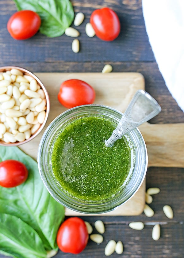 This Paleo Whole30 Basil Pesto also happens to be low fodmap, but still big on flavor! Made with fresh basil, pine nuts, and garlic oil, it is easy and so delicious! Gluten free, dairy free, and low carb.