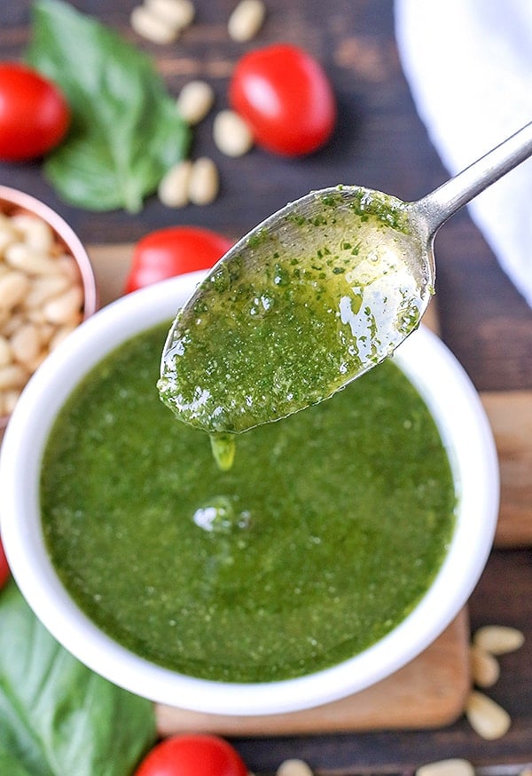 This Paleo Whole30 Basil Pesto also happens to be low fodmap, but still big on flavor! Made with fresh basil, pine nuts, and garlic oil, it is easy and so delicious! Gluten free, dairy free, and low carb.