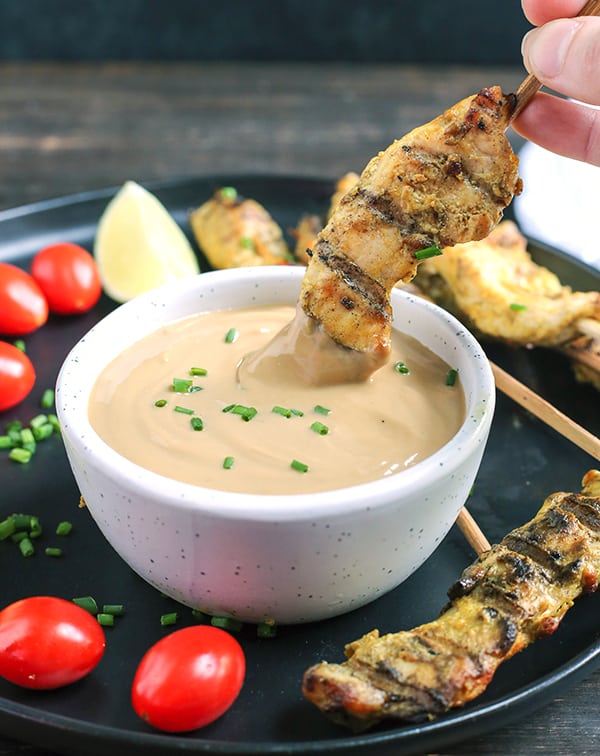 This Paleo Whole30 Chicken Satay with Sunbutter Sauce is a take on the popular Thai dish. Marinated chicken that is grilled then dipped in a flavorful sauce. Gluten free, dairy free, nut free, and low fodmap.