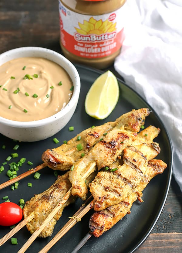 This Paleo Whole30 Chicken Satay with Sunbutter Sauce is a take on the popular Thai dish. Marinated chicken that is grilled then dipped in a flavorful sauce. Gluten free, dairy free, nut free, and low fodmap.