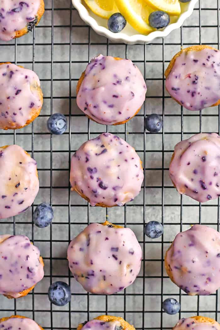 These Paleo Baked Blueberry Fritter Bites are easy to make and so delicious! Small, bite-size muffins covered in a blueberry glaze. They are gluten free, dairy free, and naturally sweetened.