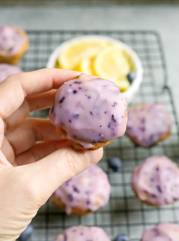 These Paleo Baked Blueberry Fritter Bites are easy to make and so delicious! Small, bite-size muffins covered in a blueberry glaze. They are gluten free, dairy free, and naturally sweetened.