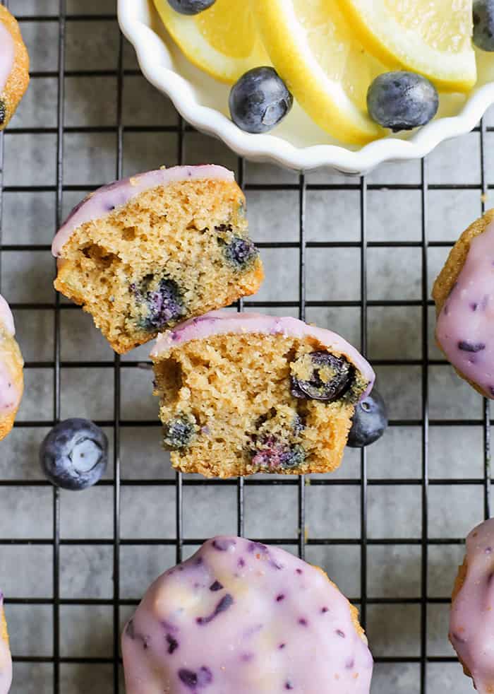 These Paleo Baked Blueberry Fritter Bites are easy to make and so delicious! Small, bite-size muffins covered in a blueberry glaze. They are gluten free, dairy free, and naturally sweetened.