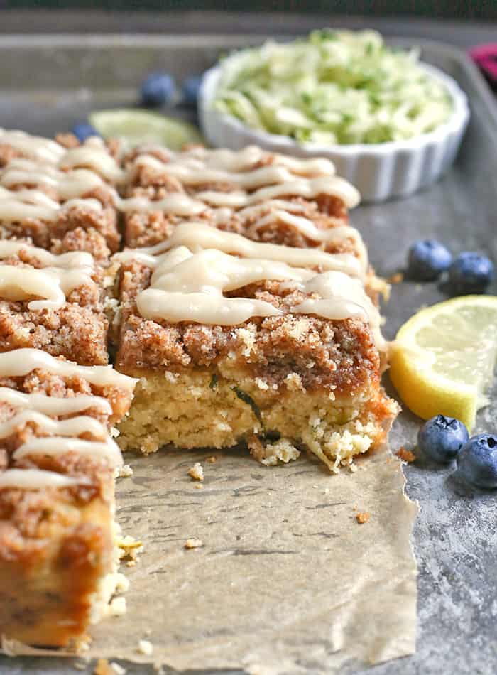 This Paleo Lemon Zucchini Coffee Cake is tender, moist, and has the best crumb topping! It's gluten free, dairy free, and is sure to become a new favorite!