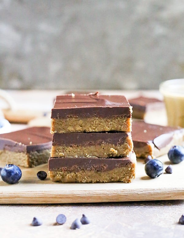 These Paleo No-Bake Nut-Free SunButter Chocolate Bars are so easy to make and totally irresistible. Soft, melt-in-your-mouth good and made healthy! They only contain 6 ingredients and are dairy free, gluten free, egg free, and vegan!