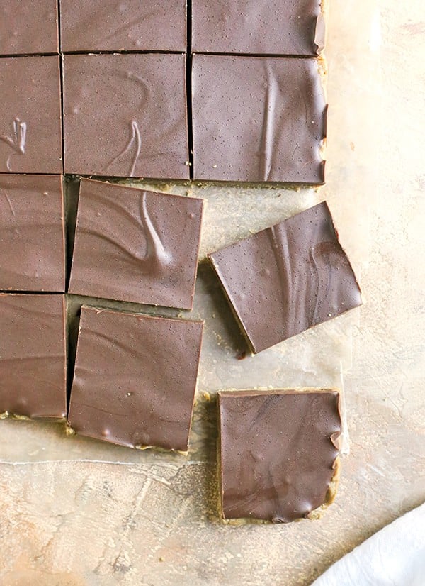 These Paleo No-Bake Nut-Free SunButter Chocolate Bars are so easy to make and totally irresistible. Soft, melt-in-your-mouth good and made healthy! They only contain 6 ingredients and are dairy free, gluten free, egg free, and vegan!