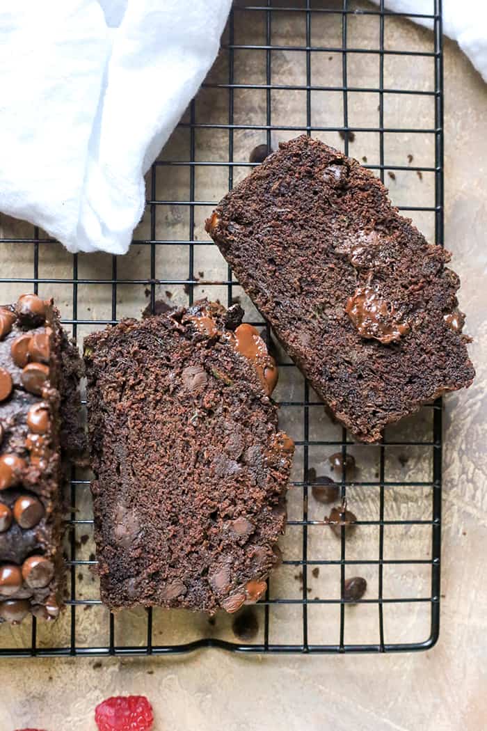 This Paleo Nut-Free Double Chocolate Zucchini Bread is rich, moist, and so chocolatey! It tastes like a decadent dessert, but made healthy! Gluten free, dairy free, and naturally sweetened.