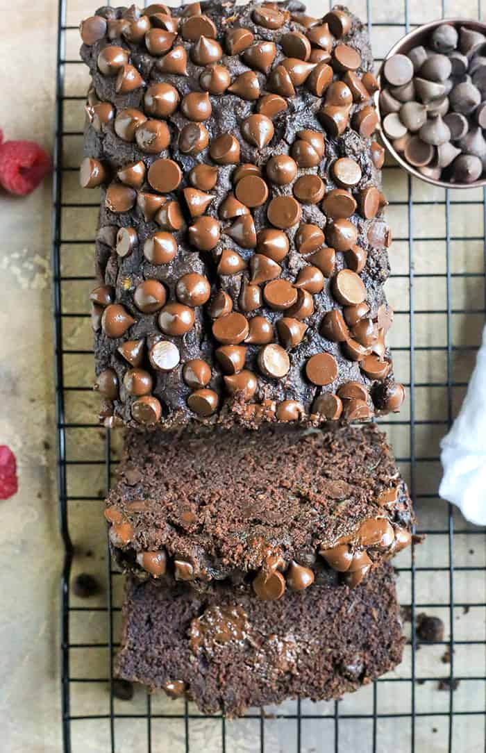 This Paleo Nut-Free Double Chocolate Zucchini Bread is rich, moist, and so chocolatey! It tastes like a decadent dessert, but made healthy! Gluten free, dairy free, and naturally sweetened.