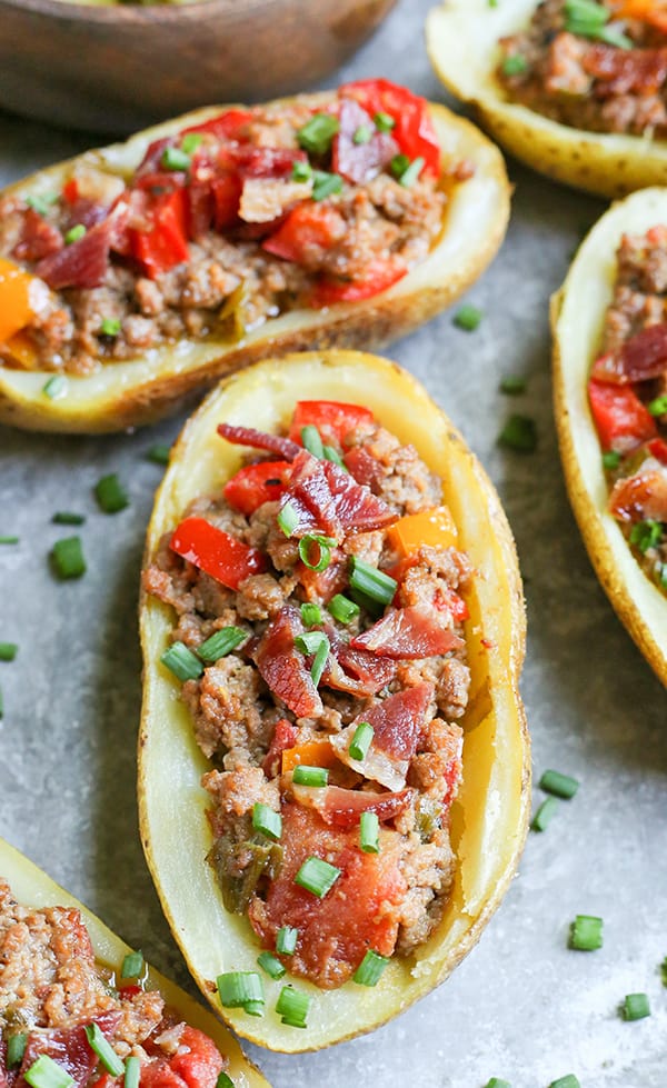 These Paleo Whole30 Bacon Hamburger Potato Skins have all the flavors of a juicy burger, but packed in a crispy potato skin. Such a fun meal that everyone will love. They are gluten free, dairy free, and low fodmap.
