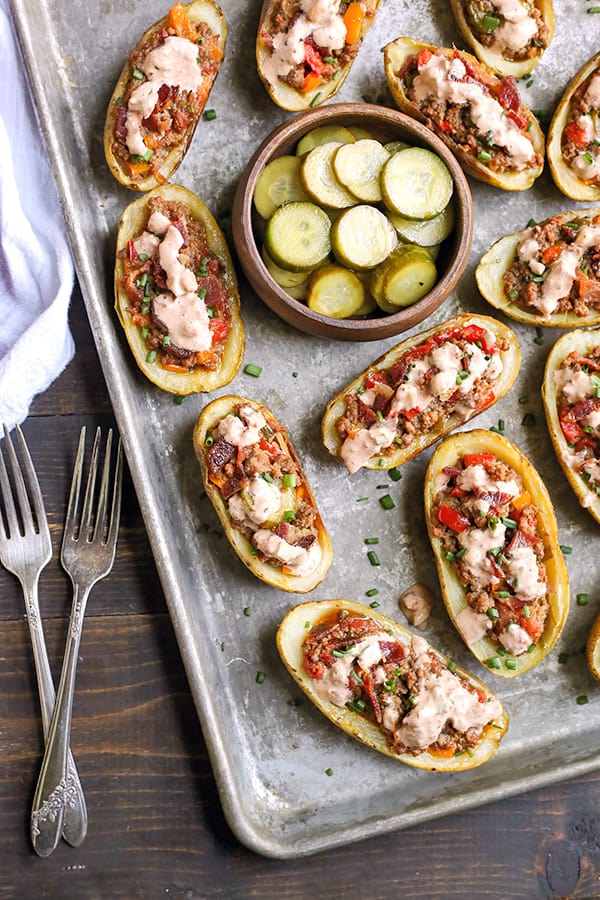 These Paleo Whole30 Bacon Hamburger Potato Skins have all the flavors of a juicy burger, but packed in a crispy potato skin. Such a fun meal that everyone will love. They are gluten free, dairy free, and low fodmap.