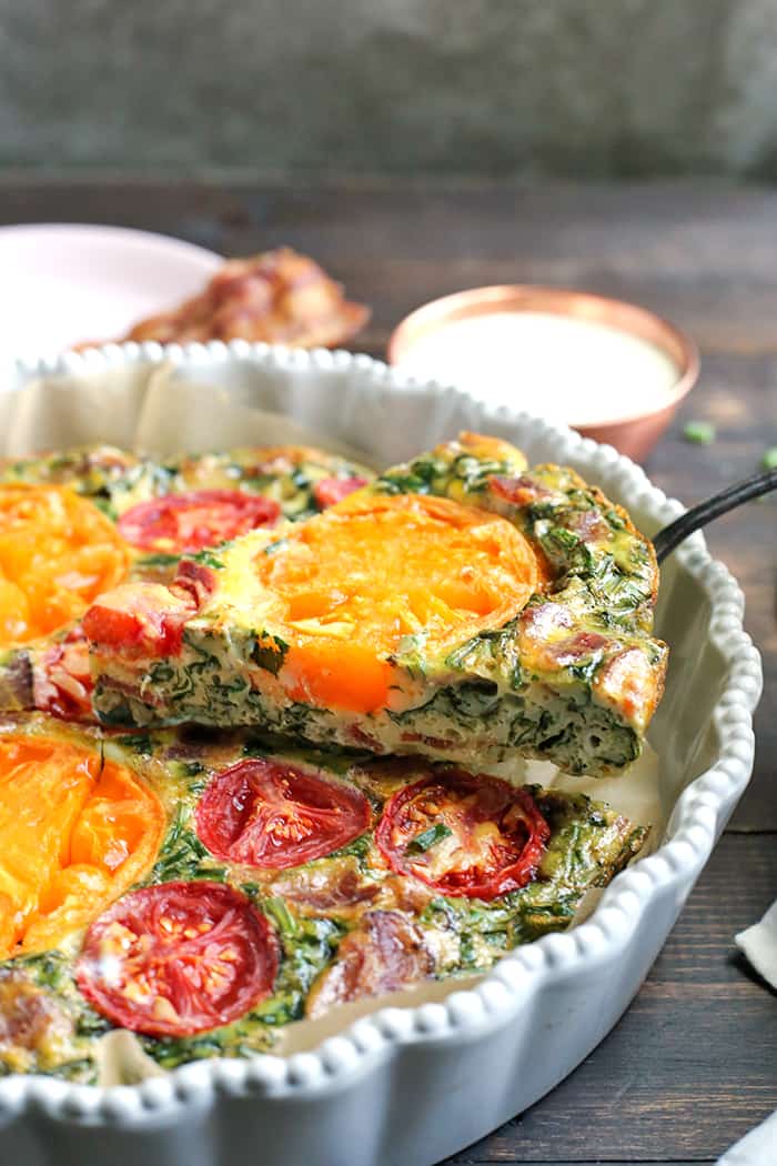 This Paleo Whole30 BLT Breakfast Bake has all the flavors of a BLT, but packed in a delicious egg bake. Crispy bacon, baby spinach, and fresh tomatoes combine for a tasty, filling breakfast. Gluten free, dairy free, low carb, and low fodmap.