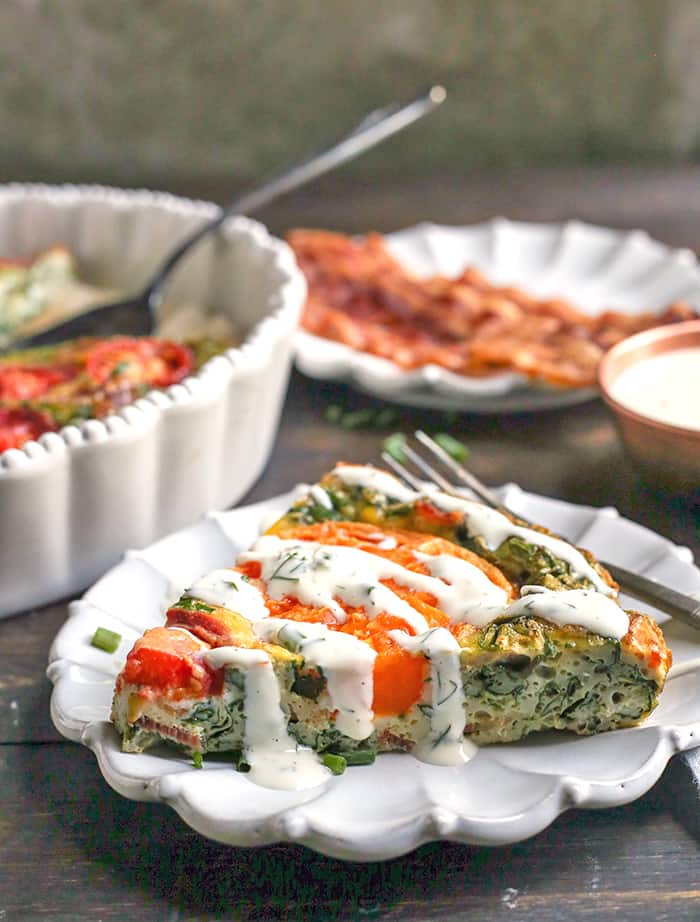 This Paleo Whole30 BLT Breakfast Bake has all the flavors of a BLT, but packed in a delicious egg bake. Crispy bacon, baby spinach, and fresh tomatoes combine for a tasty, filling breakfast. Gluten free, dairy free, low carb, and low fodmap.