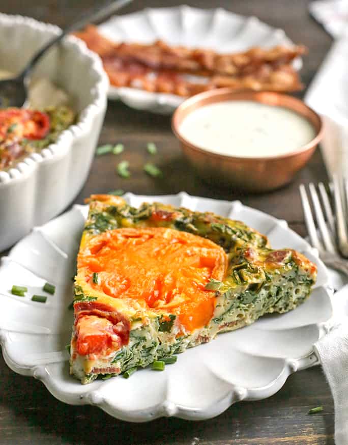 This Paleo Whole30 BLT Breakfast Bake has all the flavors of a BLT, but packed in a delicious egg bake. Crispy bacon, baby spinach, and fresh tomatoes combine for a tasty, filling breakfast. Gluten free, dairy free, low carb, and low fodmap.