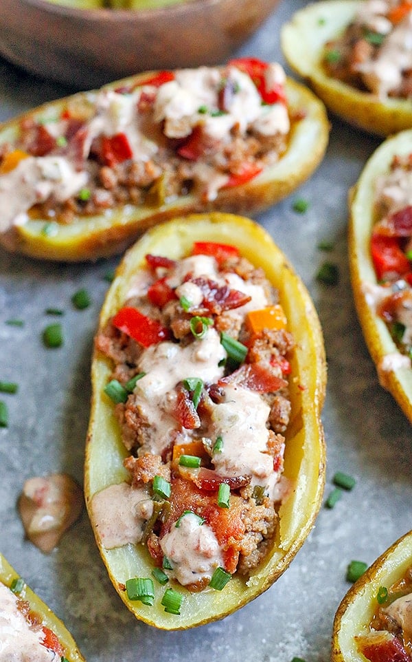 These Paleo Whole30 Bacon Hamburger Potato Skins have all the flavors of a juicy burger, but packed in a crispy potato skin. Such a fun meal that everyone will love. They are gluten free, dairy free, and low fodmap.