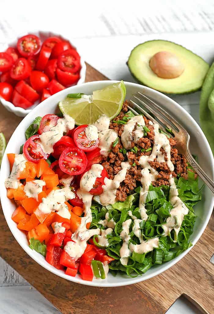 This Paleo Whole30 Taco Salad is an easy, filling, healthy meal that everyone will love. Seasoned meat and loads of veggies make for a complete meal and it's gluten free, dairy free, low fodmap, and low carb.
