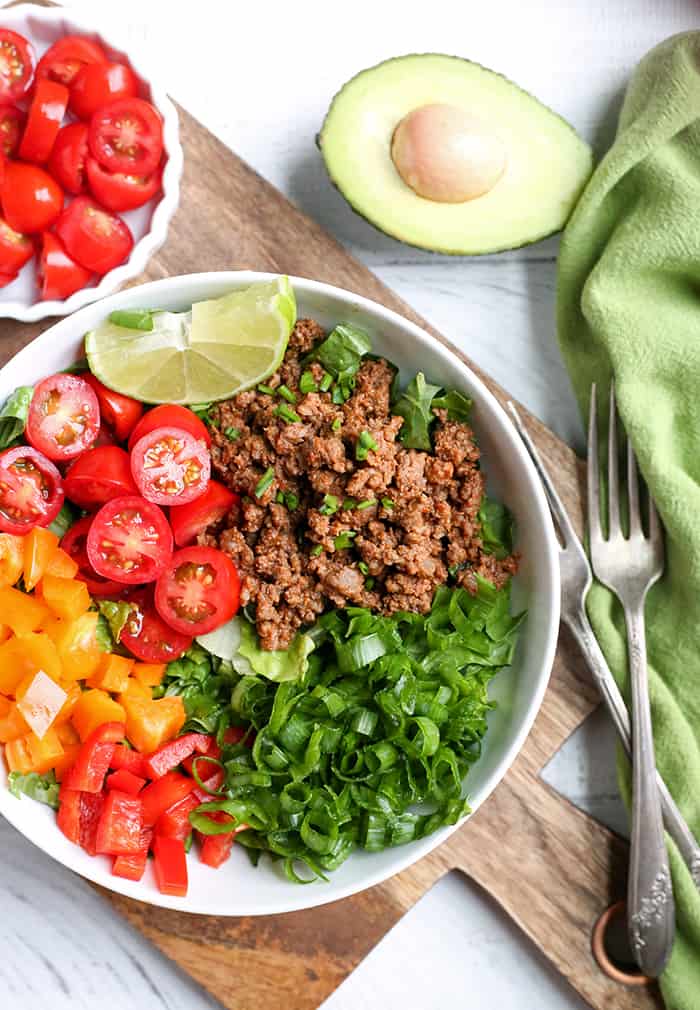 This Paleo Whole30 Taco Salad is an easy, filling, healthy meal that everyone will love. Seasoned meat and loads of veggies make for a complete meal and it's gluten free, dairy free, low fodmap, and low carb.