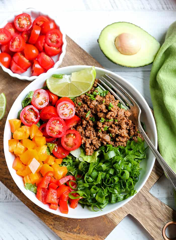 This Paleo Whole30 Taco Salad is an easy, filling, healthy meal that everyone will love. Seasoned meat and loads of veggies make for a complete meal and it's gluten free, dairy free, low fodmap, and low carb.
