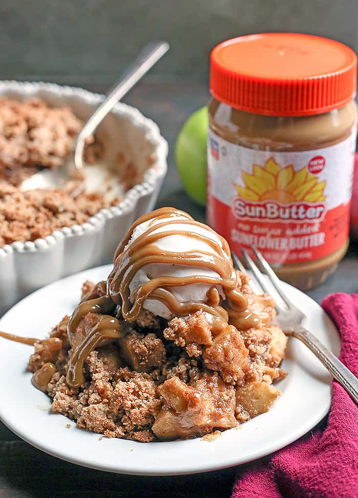 This Paleo Vegan Caramel Apple Crisp is the perfect fall treat! A simple caramel mixed together with the apples and topped with an irresistible crumb topping. Perfect with a scoop of dairy free ice cream and more caramel! It's gluten free, dairy free, and naturally sweetened.