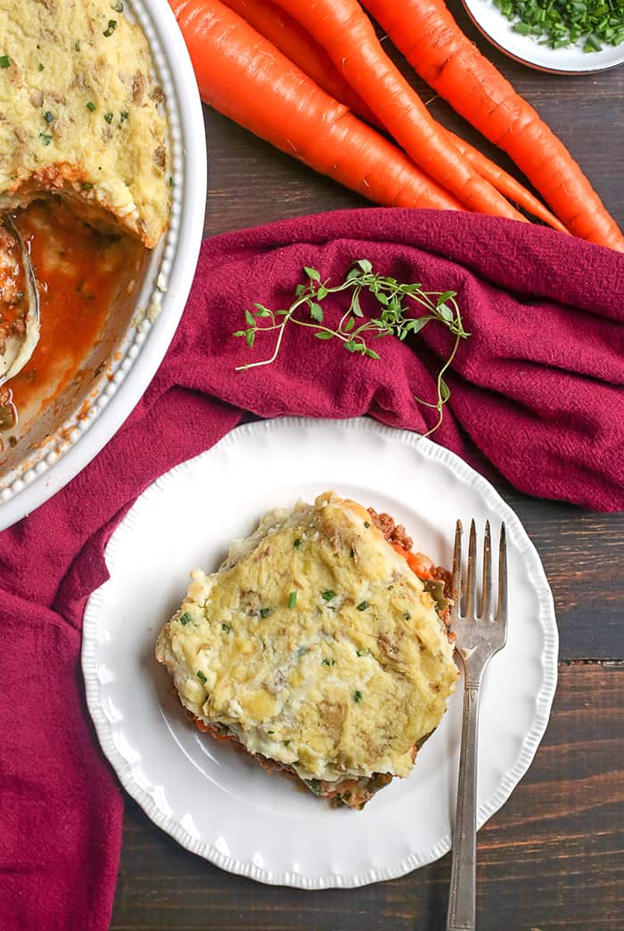 This Paleo Whole30 Shepherd's Pie is comfort food that is perfect for chilly days. A layer of lamb and veggies is topped with creamy mashed potatoes and baked together for one hearty meal. Everyone will love it! It's gluten free, dairy free, and low fodmap.