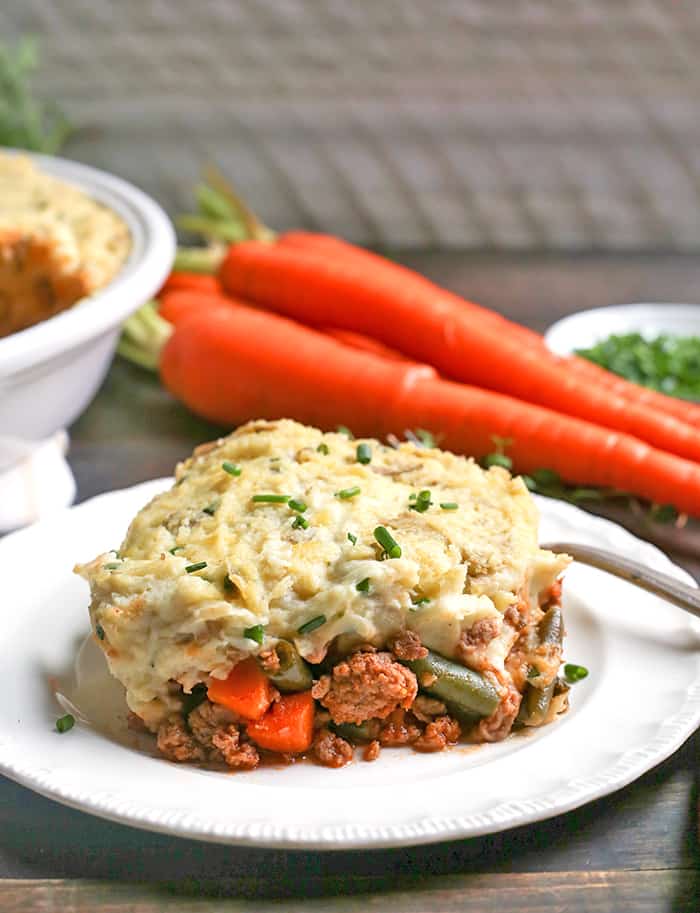 This Paleo Whole30 Shepherd's Pie is comfort food that is perfect for chilly days. A layer of lamb and veggies is topped with creamy mashed potatoes and baked together for one hearty meal. Everyone will love it! It's gluten free, dairy free, and low fodmap.