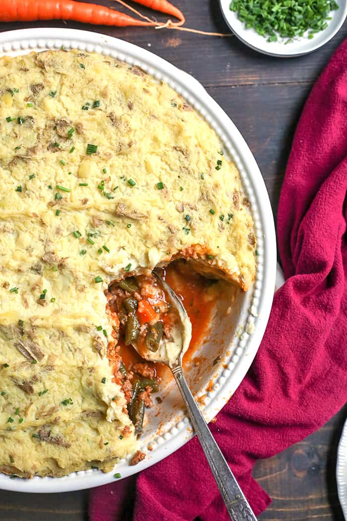 This Paleo Whole30 Shepherd's Pie is comfort food that is perfect for chilly days. A layer of lamb and veggies is topped with creamy mashed potatoes and baked together for one hearty meal. Everyone will love it! It's gluten free, dairy free, and low fodmap.