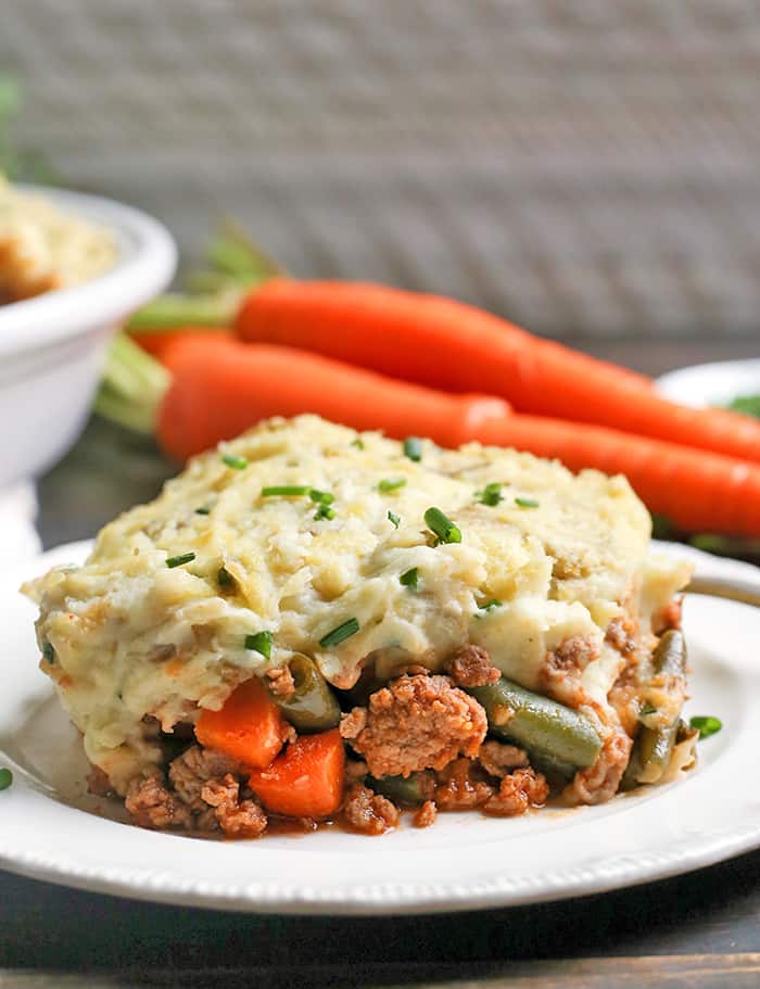 This Paleo Whole30 Shepherd's Pie is comfort food that is perfect for chilly days. A layer of lamb and veggies is topped with creamy mashed potatoes and baked together for one hearty meal. Everyone will love it! It's gluten free, dairy free, and low fodmap.