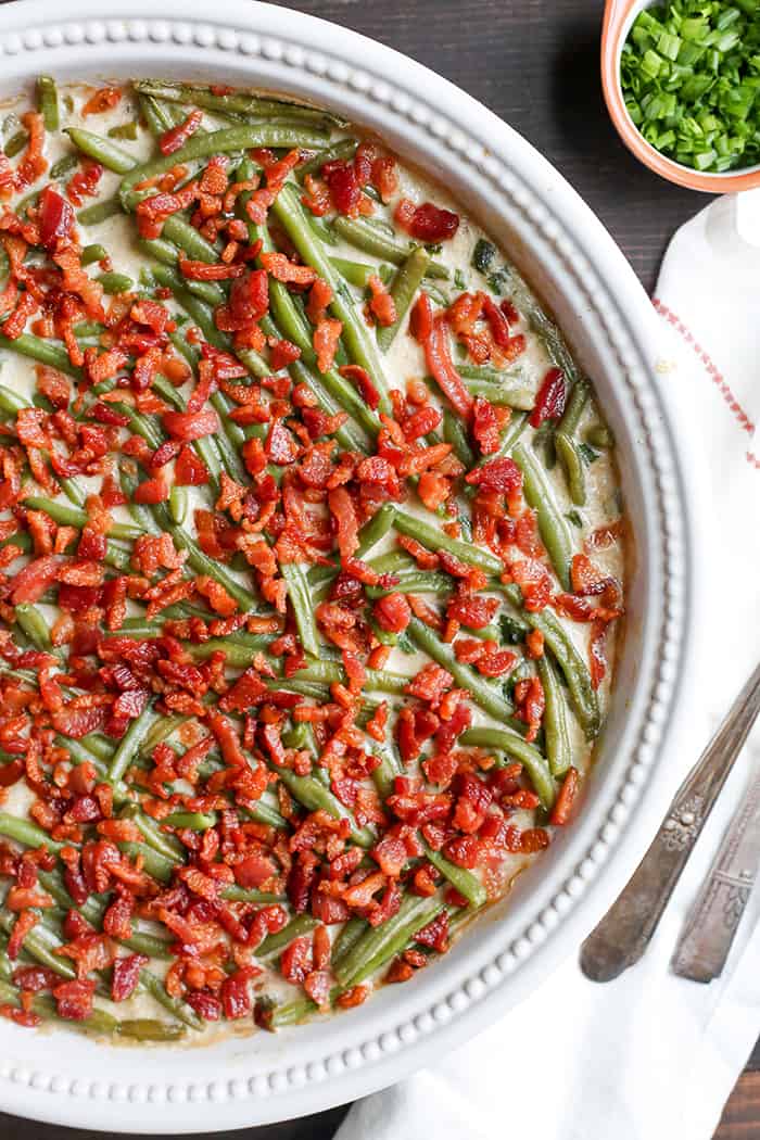 This Paleo Low FODMAP Green Bean Casserole is easy to make, full of flavor, and a healthy side dish. The green beans are covered in a creamy sauce and topped with bacon. Gluten free, dairy free, and Whole30. 