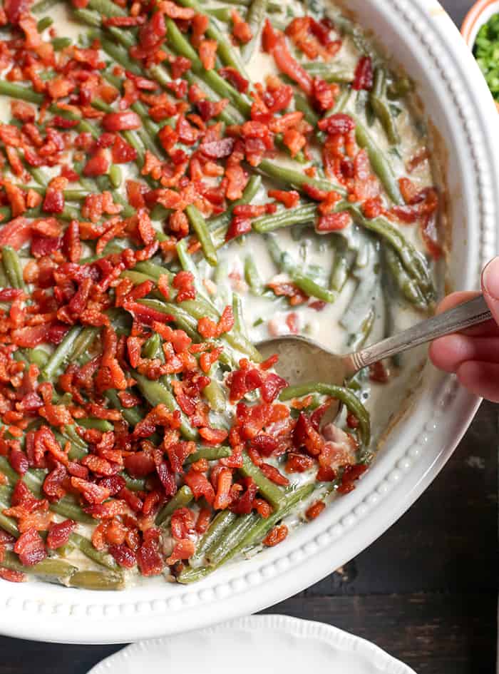 This Paleo Low FODMAP Green Bean Casserole is easy to make, full of flavor, and a healthy side dish. The green beans are covered in a creamy sauce and topped with bacon. Gluten free, dairy free, and Whole30. 