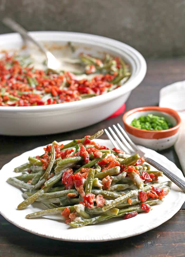 This Paleo Low FODMAP Green Bean Casserole is easy to make, full of flavor, and a healthy side dish. The green beans are covered in a creamy sauce and topped with bacon. Gluten free, dairy free, and Whole30. 