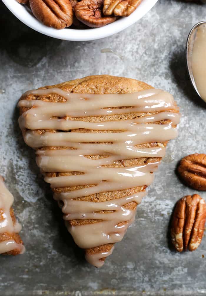 These Paleo Pecan Pie Scones are a fun treat that are easy to make and so delicious! Tender, not overly sweet, and pairs great with a cup of coffee. They are gluten free, dairy free, and naturally sweetened.